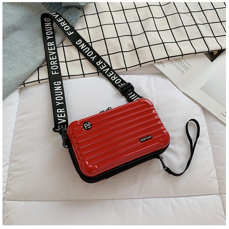 Mini suitcase in the shape of a shoulder bag