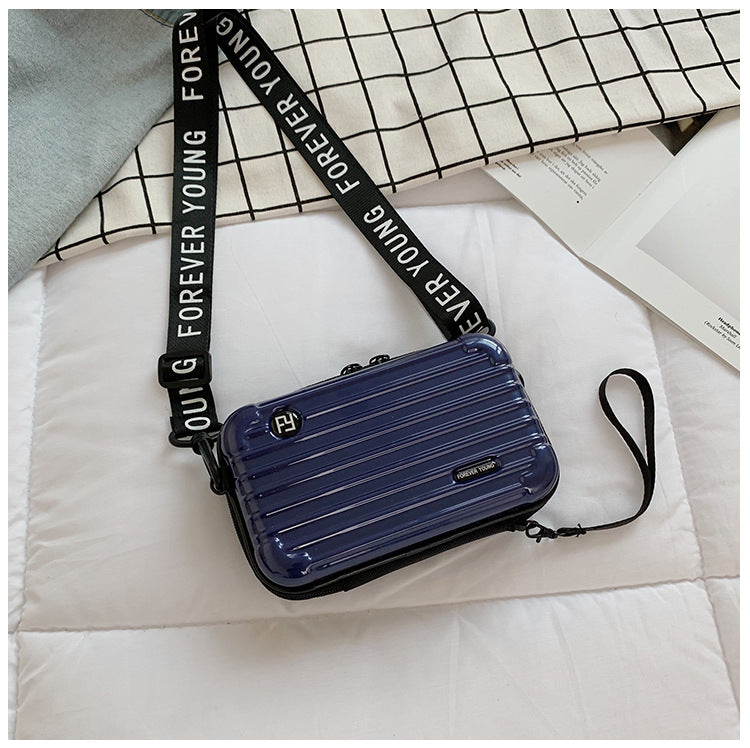 Mini suitcase in the shape of a shoulder bag