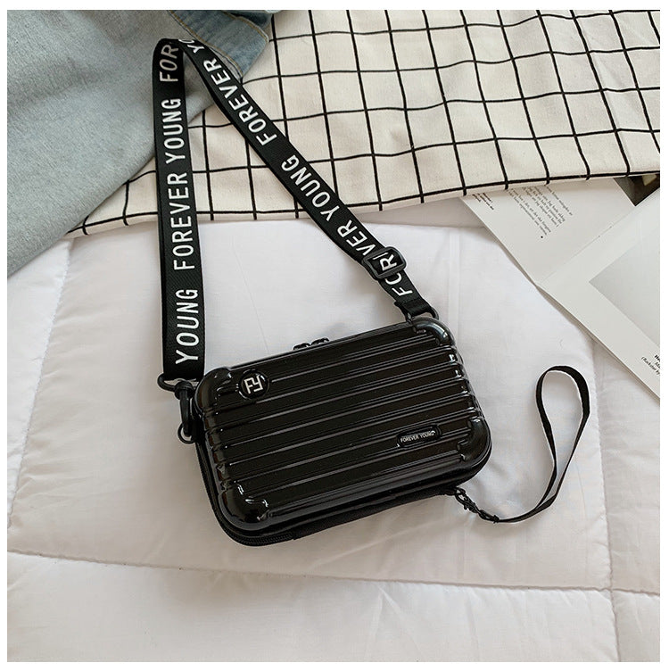 Mini suitcase in the shape of a shoulder bag
