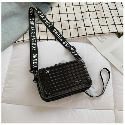 Mini suitcase in the shape of a shoulder bag