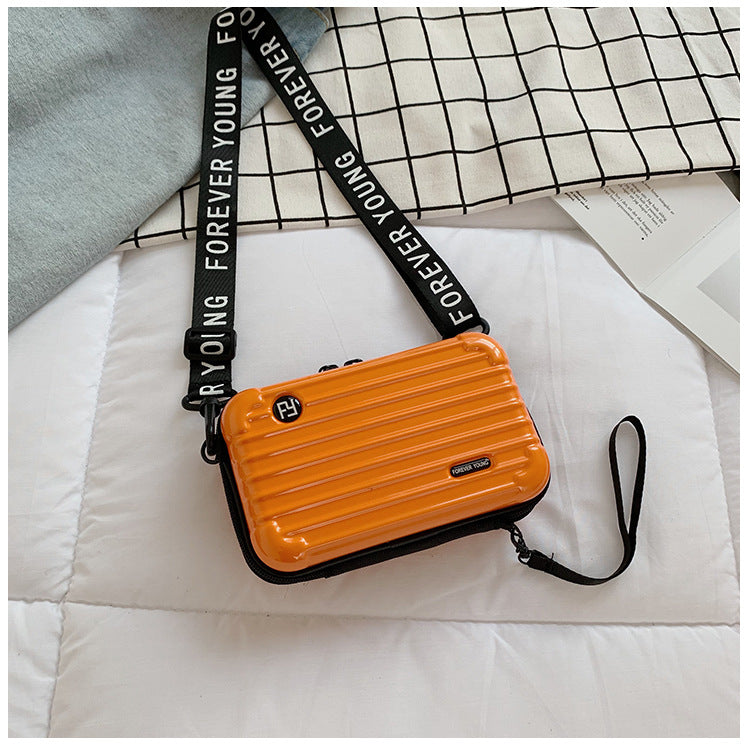 Mini suitcase in the shape of a shoulder bag