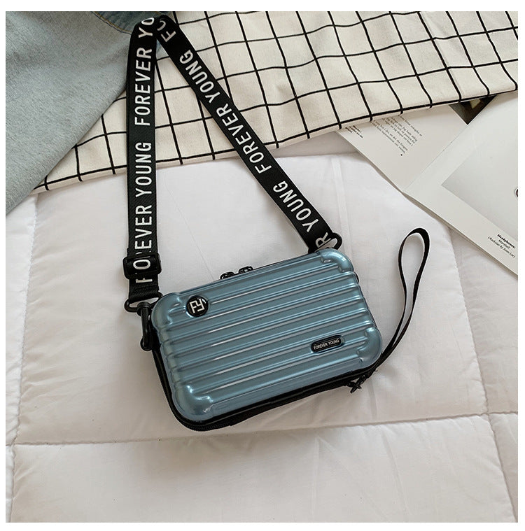 Mini suitcase in the shape of a shoulder bag