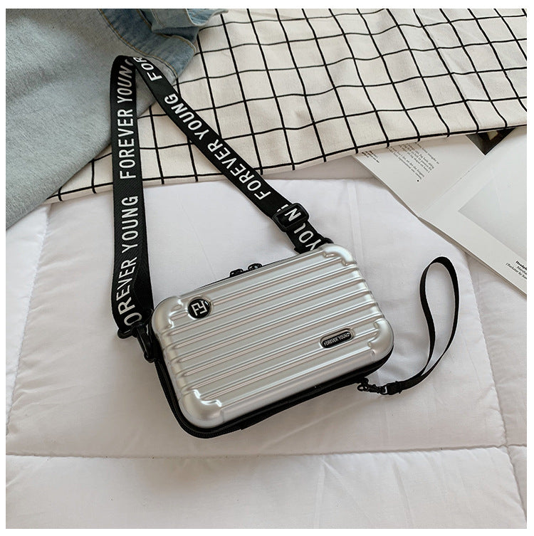 Mini suitcase in the shape of a shoulder bag