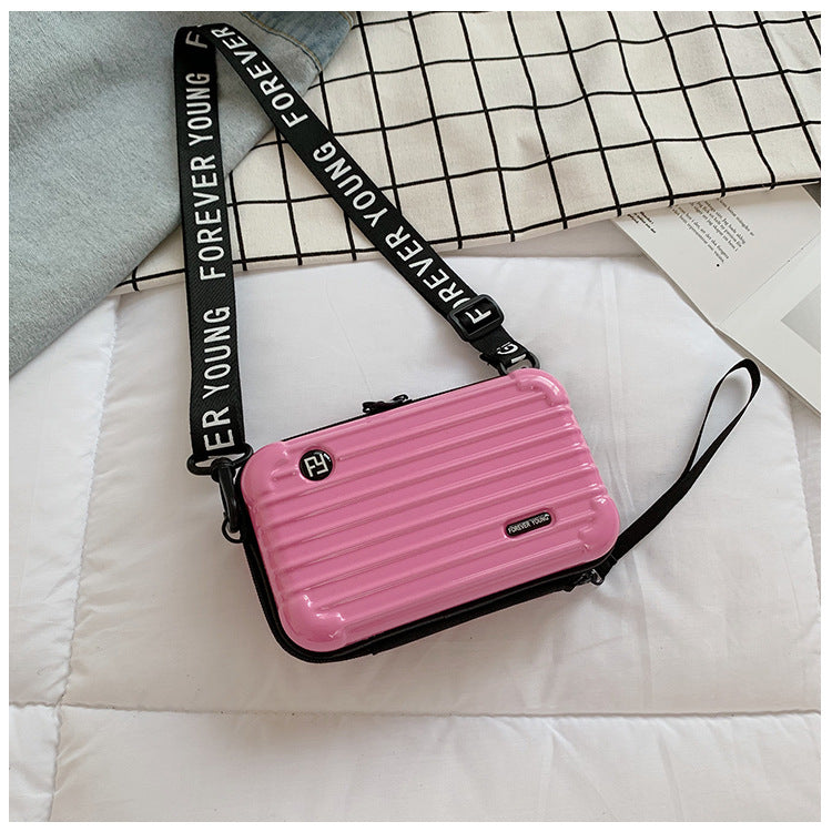 Mini suitcase in the shape of a shoulder bag