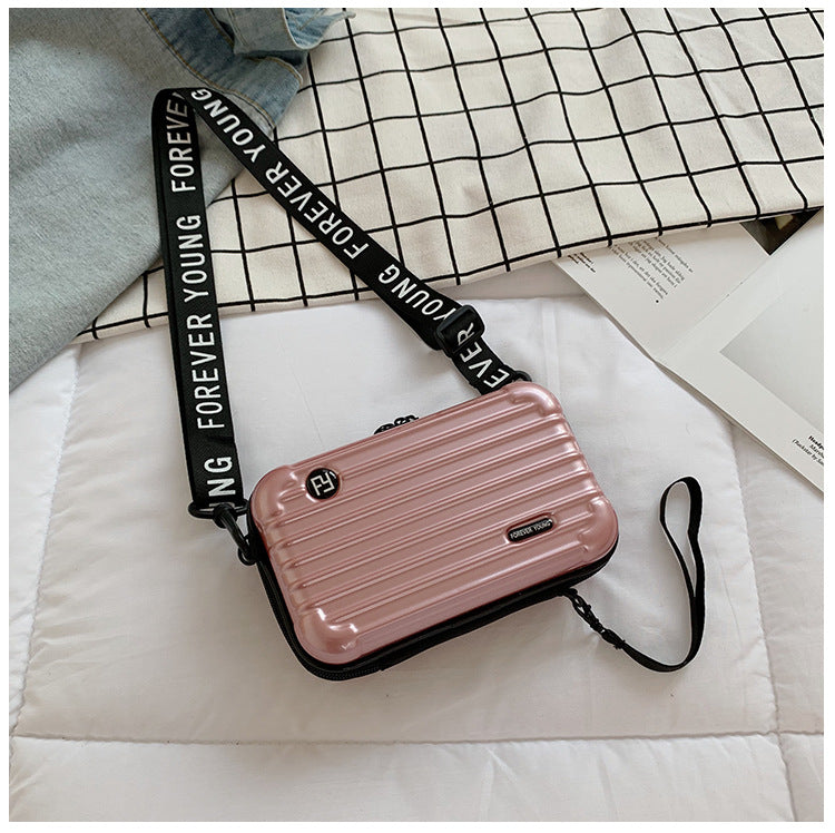 Mini suitcase in the shape of a shoulder bag