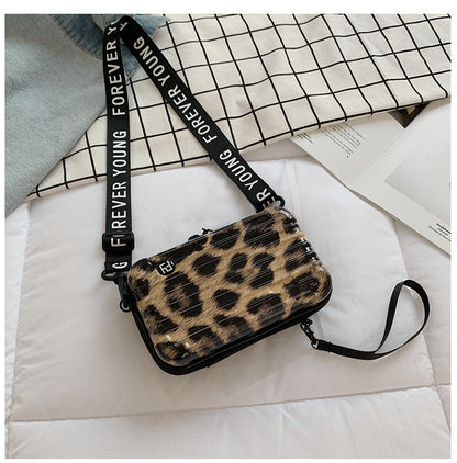 Mini suitcase in the shape of a shoulder bag