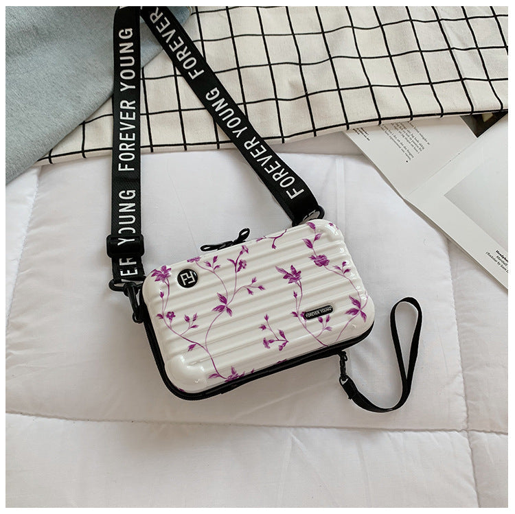 Mini suitcase in the shape of a shoulder bag