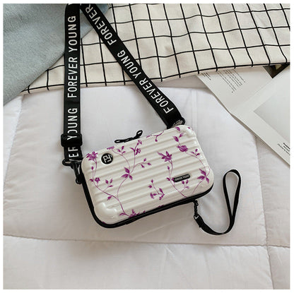 Mini suitcase in the shape of a shoulder bag