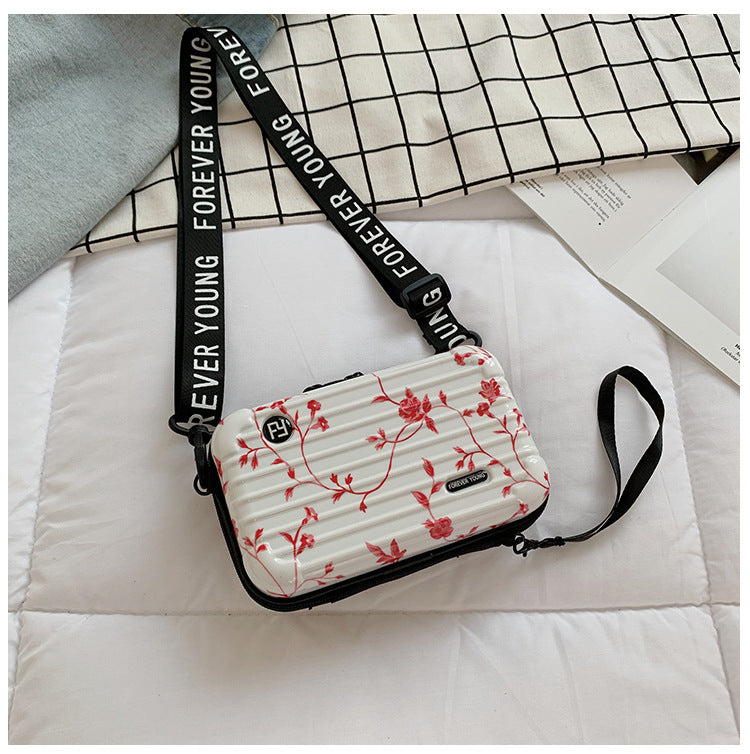 Mini suitcase in the shape of a shoulder bag