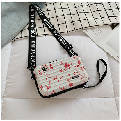 Mini suitcase in the shape of a shoulder bag