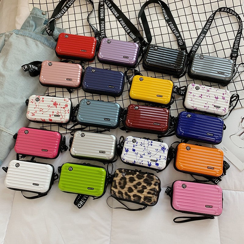 Mini suitcase in the shape of a shoulder bag